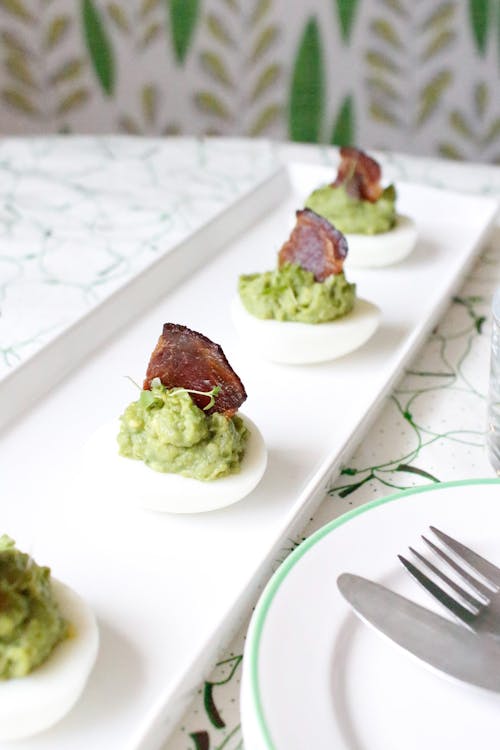 Keto avocado eggs with bacon sails