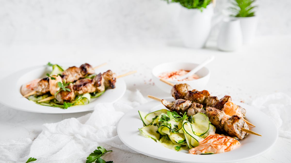 Grilled pork skewers with ribbon zoodles